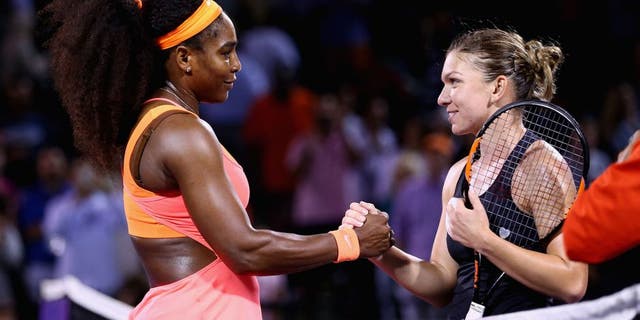 KEY BISCAYNE, FL - APRIL 02: Serena Williams of the United States shakes hands at the net after her three set victory against Simona Halep of Romania in their semi final match during the Miami Open Presented by Itau at Crandon Park Tennis Center on April 2, 2015 in Key Biscayne, Florida. (Photo by Clive Brunskill/Getty Images)