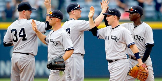 ATLANTA, GA - AUGUST 30: The New York Yankees celebrate their 20-6 win over the Atlanta Braves at Turner Field on August 30, 2015 in Atlanta, Georgia. (Photo by Kevin C. Cox/Getty Images)