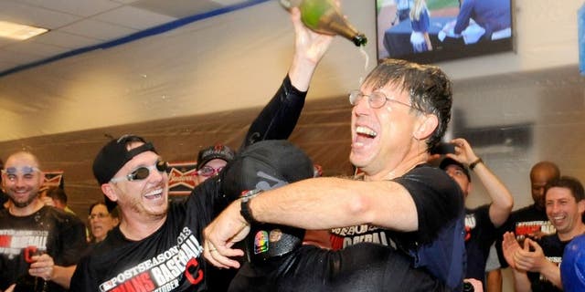 MINNEAPOLIS, MN - SEPTEMBER 29: Owner and CEO Paul Dolan of the Cleveland Indians celebrates with his team in the clubhouse after a win of the game against the Minnesota Twins on September 29, 2013 at Target Field in Minneapolis, Minnesota. The Indians defeated the Twins 5-1 and clinched a American League Wild Card berth. (Photo by Hannah Foslien/Getty Images)