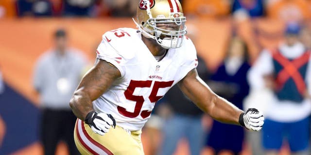 Oct 19, 2014; Denver, CO, USA; San Francisco 49ers outside linebacker Ahmad Brooks (55) reacts after a play in the first quarter against the Denver Broncos at Sports Authority Field at Mile High. Mandatory Credit: Ron Chenoy-USA TODAY Sports