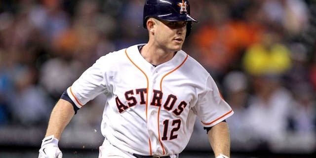 Sep 16, 2014; Houston, TX, USA; Houston Astros catcher Max Stassi (12) runs to first base with a single during the fourth inning against the Cleveland Indians at Minute Maid Park. Mandatory Credit: Troy Taormina-USA TODAY Sports