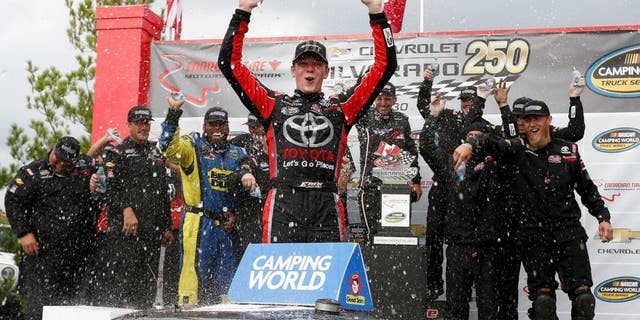 BOWMANVILLE, ON - AUGUST 30: Erik Jones, driver of the #4 Toyota Toyota, celebrates in victory lane after winning during the NASCAR Camping World Truck Series Chevrolet Silverado 250 at Canadian Tire Motorsport Park on August 30, 2015 in Bowmanville, Ontario, Canada. (Photo by Jeff Zelevansky/NASCAR via Getty Images)
