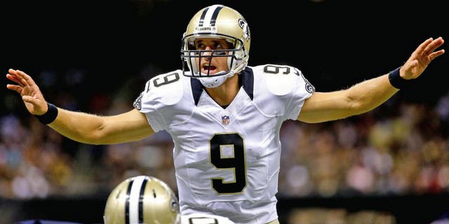 Aug 22, 2015; New Orleans, LA, USA; New Orleans Saints quarterback Drew Brees (9) audibles against the New England Patriots during the first quarter of a preseason game at the Mercedes-Benz Superdome. Mandatory Credit: Derick E. Hingle-USA TODAY Sports
