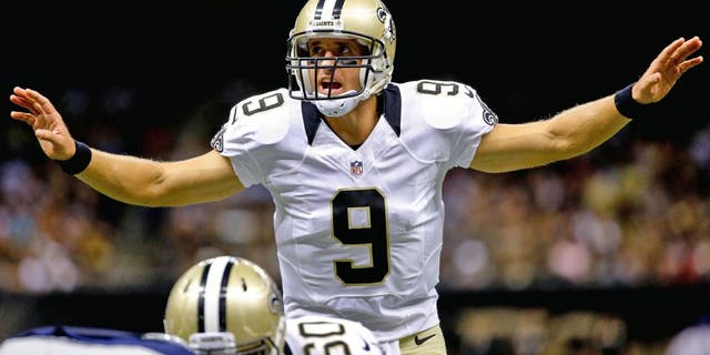 Aug 22, 2015; New Orleans, LA, USA; New Orleans Saints quarterback Drew Brees (9) audibles against the New England Patriots during the first quarter of a preseason game at the Mercedes-Benz Superdome. Mandatory Credit: Derick E. Hingle-USA TODAY Sports