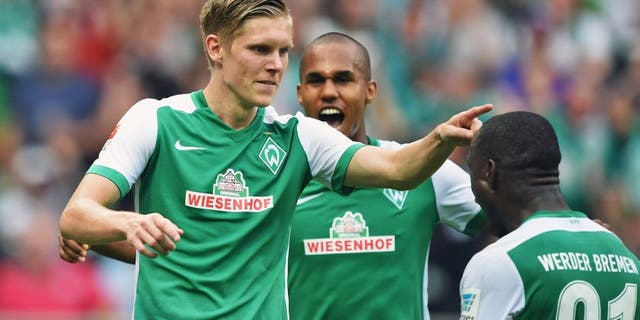 BREMEN, GERMANY - AUGUST 30: Aron Johansson of Bremen celebrates scoring his goal during the Bundesliga match between Werder Bremen and Borussia Moenchengladbach at Weserstadion on August 30, 2015 in Bremen, Germany. (Photo by Stuart Franklin/Bongarts/Getty Images)
