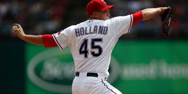 Aug 30, 2015; Arlington, TX, USA; Texas Rangers starting pitcher Derek Holland (45) delivers a pitch to the Baltimore Orioles during the fifth inning of a ballgame at Globe Life Park in Arlington. The Rangers won 6-0. Mandatory Credit: Jim Cowsert-USA TODAY Sports