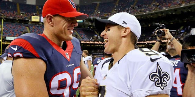 Aug 30, 2015; New Orleans, LA, USA; New Orleans Saints quarterback Drew Brees (9) and Houston Texans defensive end J.J. Watt (99) talk following a preseason game at the Mercedes-Benz Superdome. The Texans defeated the Saints 27-13. Mandatory Credit: Derick E. Hingle-USA TODAY Sports