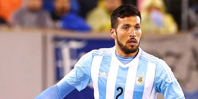EAST RUTHERFORD, UNITED STATES - MARCH 31: Ezequiel Garay #2 of Argentina moves the ball against Ecuador in the second half during an international friendly match between Argentina and Ecuador at Metlife Stadium on March 31, 2015 in East Rutherford, United States. Argentina defeated Ecuador 2-1. (Photo by Rich Schultz/LatinContent/Getty Images)