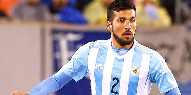 EAST RUTHERFORD, UNITED STATES - MARCH 31: Ezequiel Garay #2 of Argentina moves the ball against Ecuador in the second half during an international friendly match between Argentina and Ecuador at Metlife Stadium on March 31, 2015 in East Rutherford, United States. Argentina defeated Ecuador 2-1. (Photo by Rich Schultz/LatinContent/Getty Images)