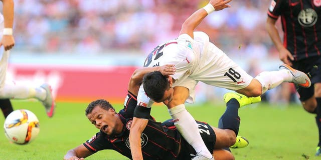 STUTTGART, GERMANY - AUGUST 29: Filip Kostic (R) of Stuttgart fights for the ball with Timothy Chandler (L) of Frankfurt during the Bundesliga match between VfB Stuttgart and Eintracht Frankfurt at Mercedes-Benz Arena on August 29, 2015 in Stuttgart, Germany. (Photo by Thomas Niedermueller/Bongarts/Getty Images)