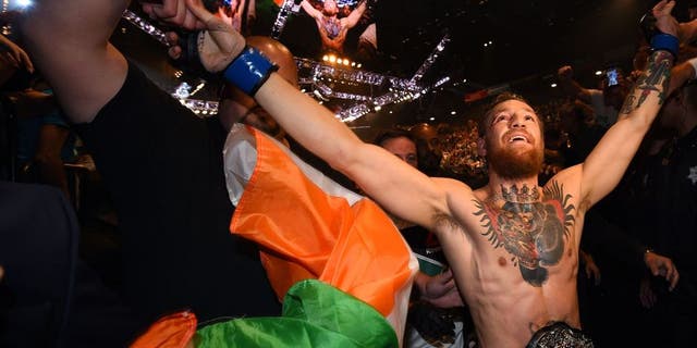 LAS VEGAS, NV - JULY 11: Conor McGregor celebrates with fans during the UFC 189 event inside MGM Grand Garden Arena on July 11, 2015 in Las Vegas, Nevada. (Photo by Jeff Bottari/Zuffa LLC/Zuffa LLC via Getty Images)