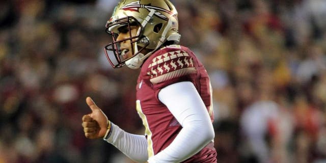Oct 18, 2014; Tallahassee, FL, USA; Florida State Seminoles kicker Roberto Aguayo (19) gives a thumbs up to the sidelines after a kick during the game against the Notre Dame Fighting Irish at Doak Campbell Stadium. Mandatory Credit: Melina Vastola-USA TODAY Sports