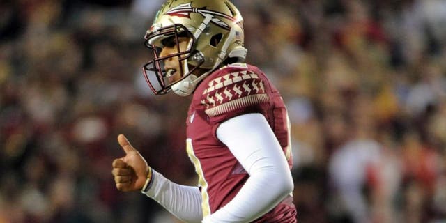 Oct 18, 2014; Tallahassee, FL, USA; Florida State Seminoles kicker Roberto Aguayo (19) gives a thumbs up to the sidelines after a kick during the game against the Notre Dame Fighting Irish at Doak Campbell Stadium. Mandatory Credit: Melina Vastola-USA TODAY Sports