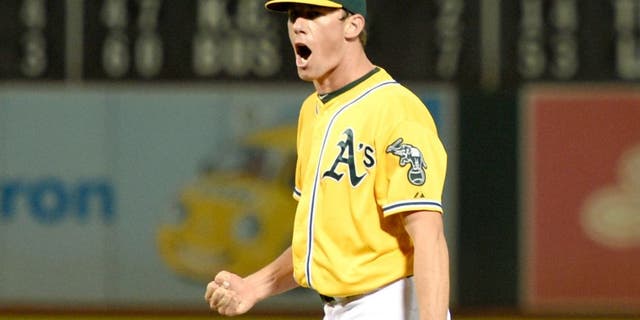 August 21, 2015; Oakland, CA, USA; Oakland Athletics starting pitcher Chris Bassitt (40) celebrates after ending the fifth inning with a double play against the Tampa Bay Rays at O.co Coliseum. The Rays defeated the Athletics 2-1. Mandatory Credit: Kyle Terada-USA TODAY Sports