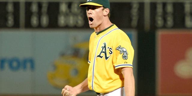 August 21, 2015; Oakland, CA, USA; Oakland Athletics starting pitcher Chris Bassitt (40) celebrates after ending the fifth inning with a double play against the Tampa Bay Rays at O.co Coliseum. The Rays defeated the Athletics 2-1. Mandatory Credit: Kyle Terada-USA TODAY Sports