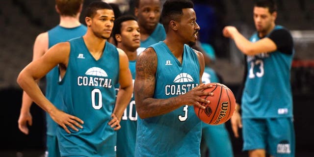 Mar 19, 2015; Omaha, NE, USA; Coastal Carolina Chanticleers guard Josh Cameron (3) and guard Warren Gillis (0) wait to run a drill during practice before the 2015 NCAA Tournament at CenturyLink Center. Mandatory Credit: Jasen Vinlove-USA TODAY Sports