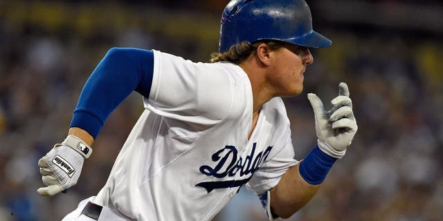LOS ANGELES, CA - AUGUST 11: Enrique Hernandez #14 of the Los Angeles Dodgers runs to first base during the game against the Washington Nationals at Dodger Stadium on August 11, 2015 in Los Angeles, California. (Photo by Lisa Blumenfeld/Getty Images)