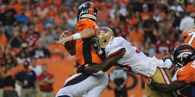 DENVER, CO - AUGUST 29: Denver Broncos quarterback Peyton Manning gets sacked by San Francisco 49ers linebacker NaVorro Bowman in the first quarter at Sports Authority Field at Mile High on Saturday, August 29, 2015. (Photo by Steve Nehf/The Denver Post via Getty Images)