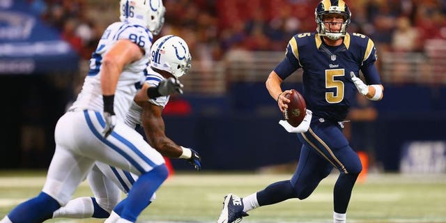 ST. LOUIS, MO - AUGUST 29: Nick Foles #5 of the St. Louis Rams looks to pass the ball against the Indianapolis Colts in the second quarter during a preseason game at the Edward Jones Dome on August 29, 2014 in St. Louis, Missouri. (Photo by Dilip Vishwanat/Getty Images)
