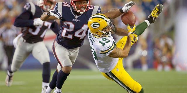 Aug 13, 2015; Foxborough, MA, USA; New England Patriots defensive back Bradley Fletcher (24) defends against Green Bay Packers wide receiver Myles White (19) during the first half in a preseason NFL football game at Gillette Stadium. Mandatory Credit: David Butler II-USA TODAY Sports