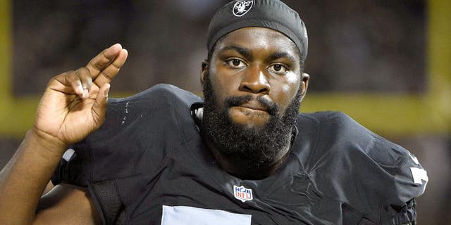 August 14, 2015; Oakland, CA, USA; Oakland Raiders tackle Menelik Watson (71) on the sideline during the fourth quarter in a preseason NFL football game against the St. Louis Rams at O.co Coliseum. The Raiders defeated the Rams 18-3. Mandatory Credit: Kyle Terada-USA TODAY Sports