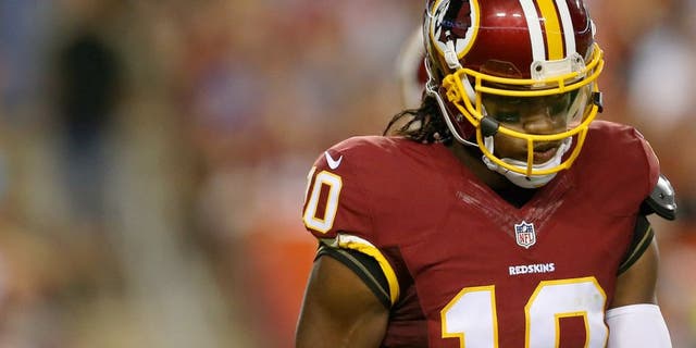 Quarterback Robert Griffin III #10 of the Washington Redskins walks off the field during a preseason game against the Detroit Lions at FedEx Field on August 20, 2015 in Landover, Maryland. (Photo by Matt Hazlett/Getty Images)