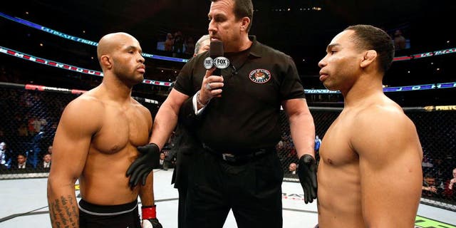 CHICAGO, IL - JANUARY 26: John Dodson (R) face off with Demetrious Johnson (L) during thier Flyweight Championship Bout part of UFC on FOX at United Center on January 26, 2013 in Chicago, Illinois. (Photo by Josh Hedges/Zuffa LLC/Zuffa LLC Via Getty Images)