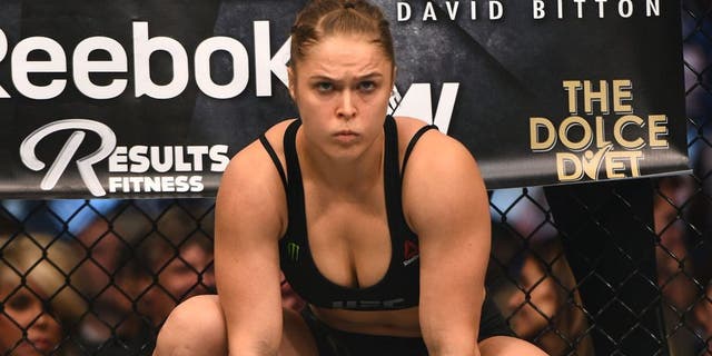LOS ANGELES, CA - FEBRUARY 28: Ronda Rousey enters the Octagon in her UFC women's bantamweight championship bout against Cat Zingano during the UFC 184 event at Staples Center on February 28, 2015 in Los Angeles, California. (Photo by Jeff Bottari/Zuffa LLC/Zuffa LLC via Getty Images)