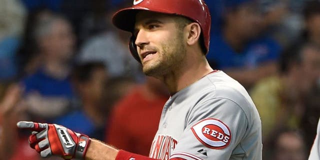 Jun 13, 2015; Chicago, IL, USA; Cincinnati Reds first baseman Joey Votto (19) reacts as he crosses home plate after hitting a home run against the Chicago Cubs during the fourth inning at Wrigley Field. Mandatory Credit: David Banks-USA TODAY Sports