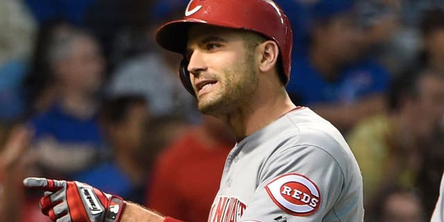 Jun 13, 2015; Chicago, IL, USA; Cincinnati Reds first baseman Joey Votto (19) reacts as he crosses home plate after hitting a home run against the Chicago Cubs during the fourth inning at Wrigley Field. Mandatory Credit: David Banks-USA TODAY Sports