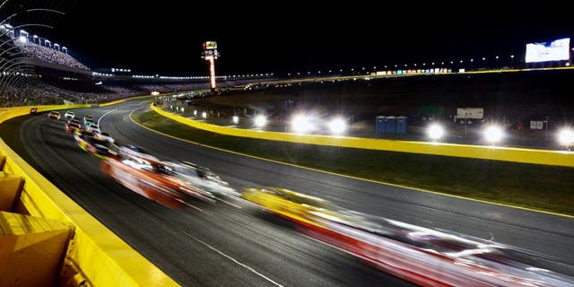 CHARLOTTE, NC - MAY 16: Cars race during the NASCAR Sprint Cup Series Sprint All-Star Race at Charlotte Motor Speedway on May 16, 2015 in Charlotte, North Carolina. (Photo by Drew Hallowell/Getty Images)