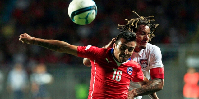 U.S. player Jermain Jones, behind, fights for the ball with Chile's Gonzalo Fierro during a friendly soccer match in Rancagua, Chile, Wednesday, Jan. 28, 2015. (AP Photo/Luis Hidalgo)