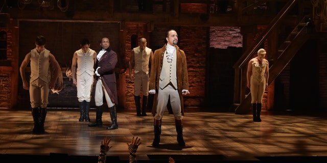 NEW YORK, NY - FEBRUARY 15: Actor Leslie Odom, Jr. (L) and actor, composer Lin-Manuel Miranda (R) perform on stage during "Hamilton" GRAMMY performance for The 58th GRAMMY Awards at Richard Rodgers Theater on February 15, 2016 in New York City. (Photo by Theo Wargo/Getty Images)