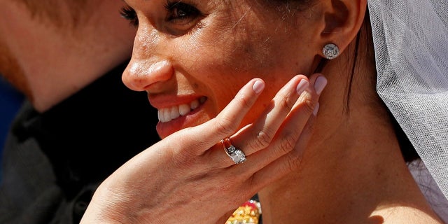 Meghan Markle shows off her ring after marrying Prince Harry on Saturday, May 19, 2018.