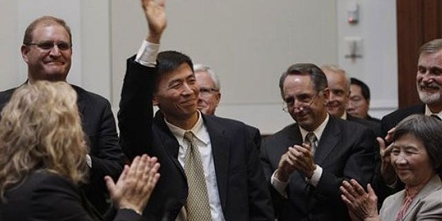 August 31: University of California, Berkeley law professor Goodwin Liu waves after he was confirmed by a three member appointment board of the Commission on Judicial Appointments in San Francisco.