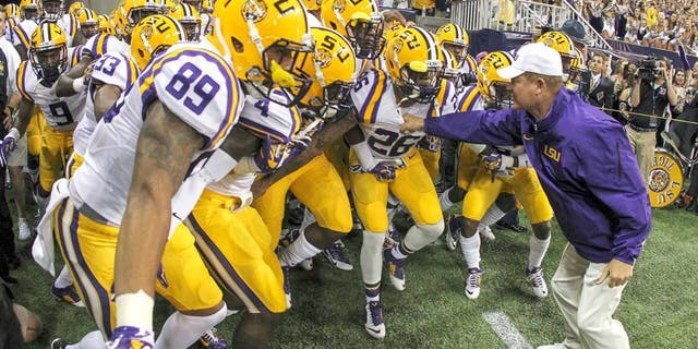Aug 30, 2014; Houston, TX, USA; LSU Tigers head coach Les Miles leads the team onto the field before a game against the Wisconsin Badgers at NRG Stadium. Mandatory Credit: Troy Taormina-USA TODAY Sports