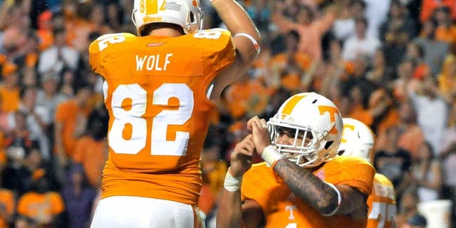 Aug 31, 2014; Knoxville, TN, USA; Tennessee Volunteers running back Jalen Hurd (1) celebrates scoring his first college career touchdown against the Utah State Aggies with teammate Tennessee tight end Ethan Wolf (82) during the second half at Neyland Stadium. Tennessee won 38-7. Mandatory Credit: Jim Brown-USA TODAY Sports