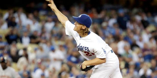 Los Angeles Dodgers starting pitcher Zack Greinke throws to the San Francisco Giants during the first inning of a baseball game in Los Angeles, Tuesday, Sept. 1, 2015. (AP Photo/Chris Carlson)