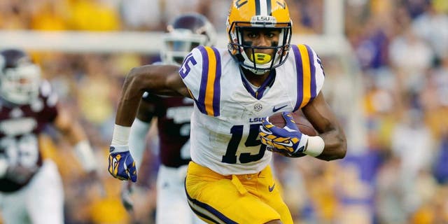 Sep 20, 2014; Baton Rouge, LA, USA; LSU Tigers wide receiver Malachi Dupre (15) runs after a catch against the Mississippi State Bulldogs during the first half of a game at Tiger Stadium. Mandatory Credit: Derick E. Hingle-USA TODAY Sports