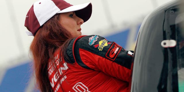 KANSAS CITY, KS - MAY 08: Jennifer Jo Cobb, driver of the #10 Mark One Electric Chevrolet, gets in her truck during qualifying for the NASCAR Camping World Truck Series Toyota Tundra 250 at Kansas Speedway on May 8, 2015 in Kansas City, Kansas. (Photo by Brian Lawdermilk/NASCAR via Getty Images)