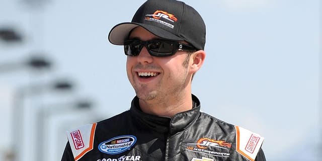 NEWTON, IA - AUGUST 02: Josh Berry, driver of the #5 Tackle Gab Chevrolet, stands on the grid during qualification for NASCAR Nationwide Series U.S. Cellular 250 Presented by New Holland at Iowa Speedway on August 2, 2014 in Newton, Iowa. (Photo by Jonathan Moore/Getty Images)
