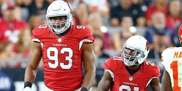 Aug 15, 2015; Glendale, AZ, USA; Arizona Cardinals defensive end Calais Campbell (93) celebrates a tackle with cornerback Patrick Peterson (21) in the first quarter against the Kansas City Chiefs in a preseason NFL football game at University of Phoenix Stadium. Mandatory Credit: Mark J. Rebilas-USA TODAY Sports