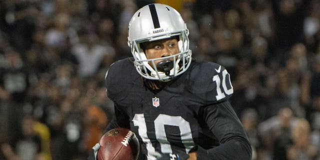 August 30, 2015; Oakland, CA, USA; Oakland Raiders wide receiver Seth Roberts (10) runs with the football during the fourth quarter in a preseason NFL football game against the Arizona Cardinals at O.co Coliseum. The Cardinals defeated the Raiders 30-23. Mandatory Credit: Kyle Terada-USA TODAY Sports