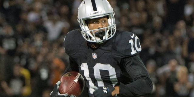 August 30, 2015; Oakland, CA, USA; Oakland Raiders wide receiver Seth Roberts (10) runs with the football during the fourth quarter in a preseason NFL football game against the Arizona Cardinals at O.co Coliseum. The Cardinals defeated the Raiders 30-23. Mandatory Credit: Kyle Terada-USA TODAY Sports
