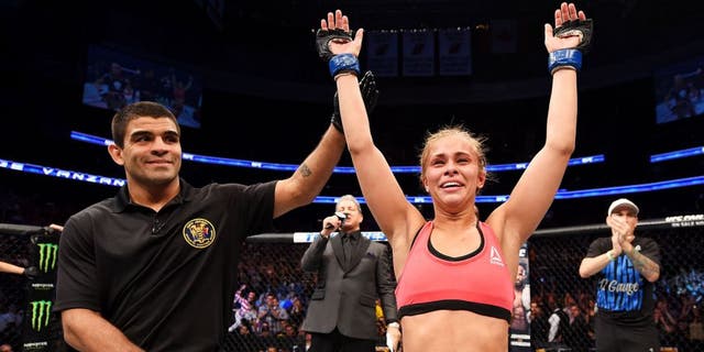 NEWARK, NJ - APRIL 18: Paige VanZant celebrates defeating Felice Herrig in their women's strawweight bout during the UFC Fight Night event at Prudential Center on April 18, 2015 in Newark, New Jersey. (Photo by Josh Hedges/Zuffa LLC/Zuffa LLC via Getty Images)