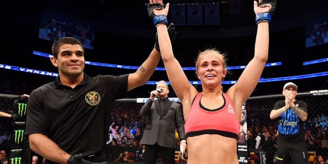 NEWARK, NJ - APRIL 18: Paige VanZant celebrates defeating Felice Herrig in their women's strawweight bout during the UFC Fight Night event at Prudential Center on April 18, 2015 in Newark, New Jersey. (Photo by Josh Hedges/Zuffa LLC/Zuffa LLC via Getty Images)