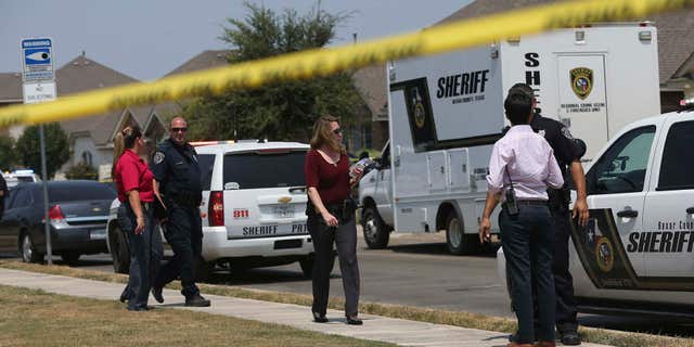 Aug. 28, 2015: The Bexar County Sheriff's Department investigates the scene where deputies shot a man as they responded to a domestic disturbance call in Northwest Bexar County, Texas, near San Antonio.