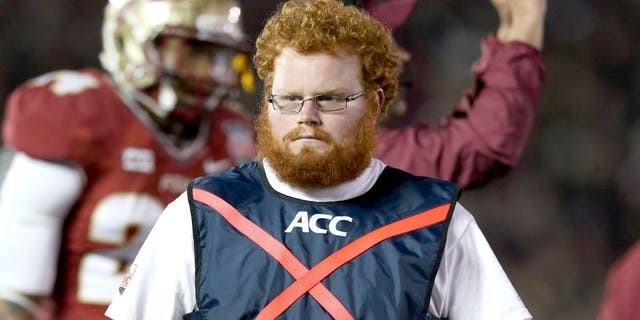 Jan 6, 2014; Pasadena, CA, USA; Florida State Seminoles ball boy assistant equipment manager Frankie Grizzle-Malgrat also know as Red Lightning on the sidelines during the game against the Auburn Tigers in the 2014 BCS National Championship game at the Rose Bowl. Mandatory Credit: Matthew Emmons-USA TODAY Sports