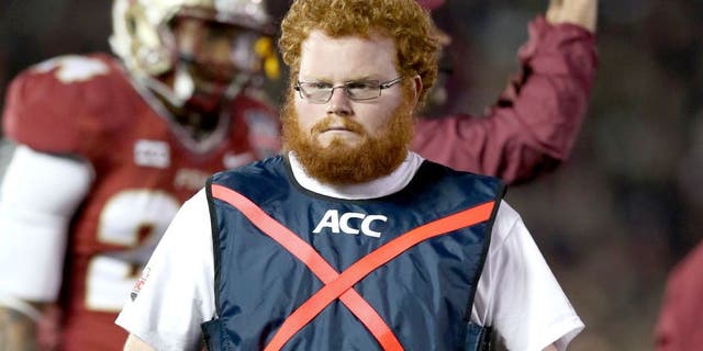 Jan 6, 2014; Pasadena, CA, USA; Florida State Seminoles ball boy assistant equipment manager Frankie Grizzle-Malgrat also know as Red Lightning on the sidelines during the game against the Auburn Tigers in the 2014 BCS National Championship game at the Rose Bowl. Mandatory Credit: Matthew Emmons-USA TODAY Sports
