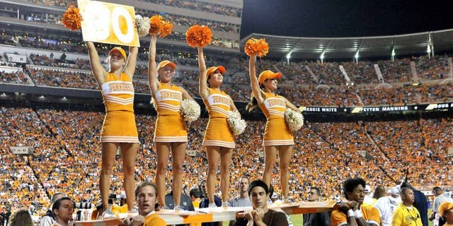 Aug 31, 2014; Knoxville, TN, USA; Tennessee Volunteers cheerleaders entertain fans during the first half against the Utah State Aggies at Neyland Stadium. Mandatory Credit: Jim Brown-USA TODAY Sports